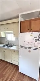 a view of kitchen with wooden floor