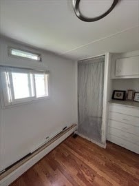 1515 VFW Parkway, Unit M19 Boston, MA 02132 - Photo 4 of 13 a view of an empty room and window