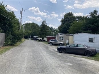 1515 VFW Parkway, Unit M19 Boston, MA 02132 - Photo 10 of 13 a car parked on the side of a road