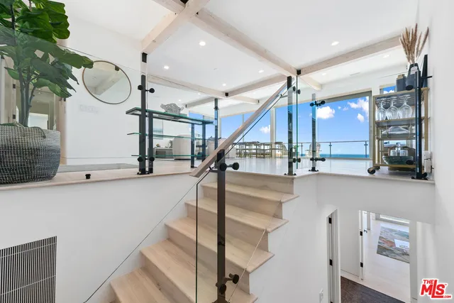 a view of a hallway with closet and a couch