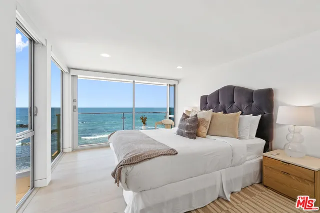 a view of living room with furniture and floor to ceiling window