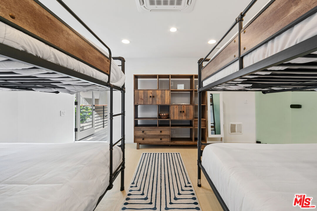 24928 Malibu Road Malibu, CA 90265 - Photo 29 of 50 a bedroom with a bed and a walk in closet