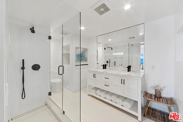 a view of a balcony with wooden floor and door