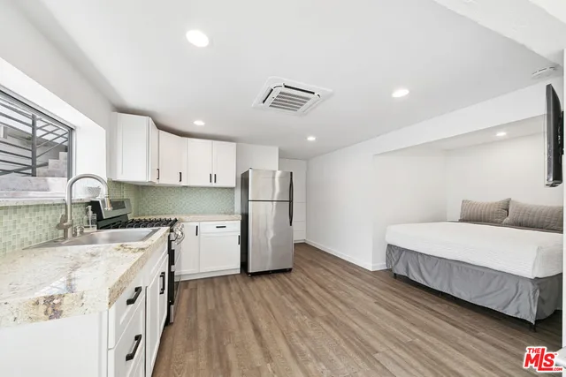 a bathroom with a toilet sink and shower