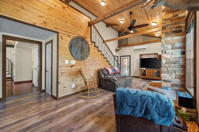 a view of a livingroom with furniture staircase and a living room
