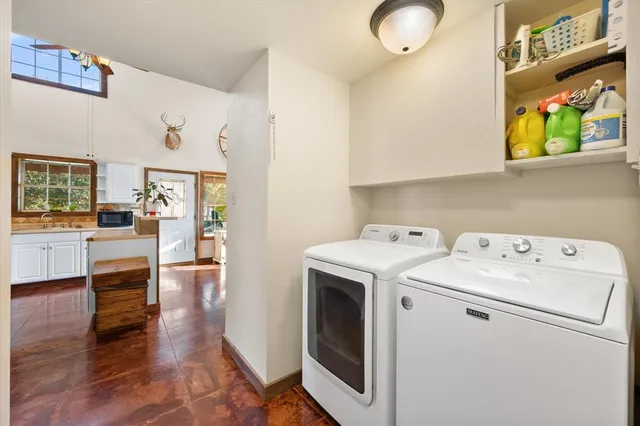 a bedroom with a bed a window and dresser