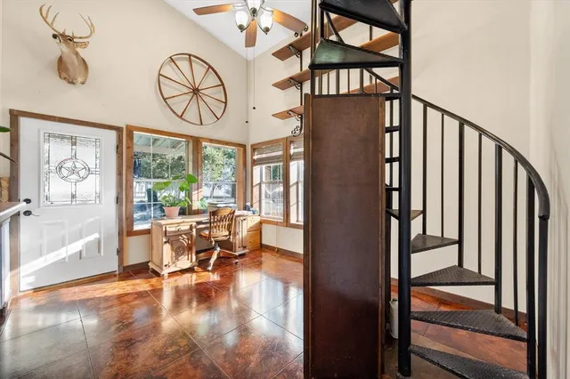 a kitchen with stainless steel appliances a refrigerator and a stove top oven