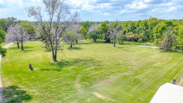 a view of a lake with a yard