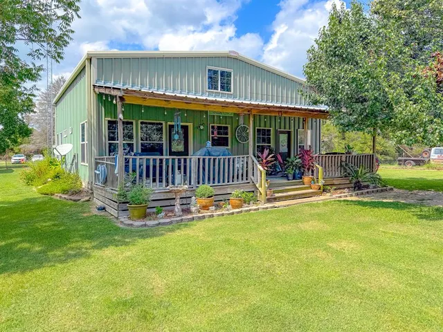 a spacious bathroom with a sink and a mirror