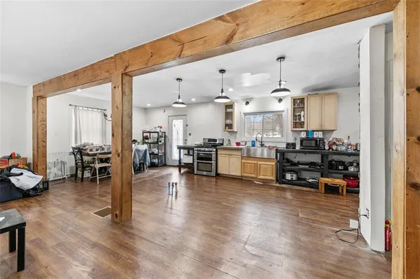 a kitchen with sink and cabinets