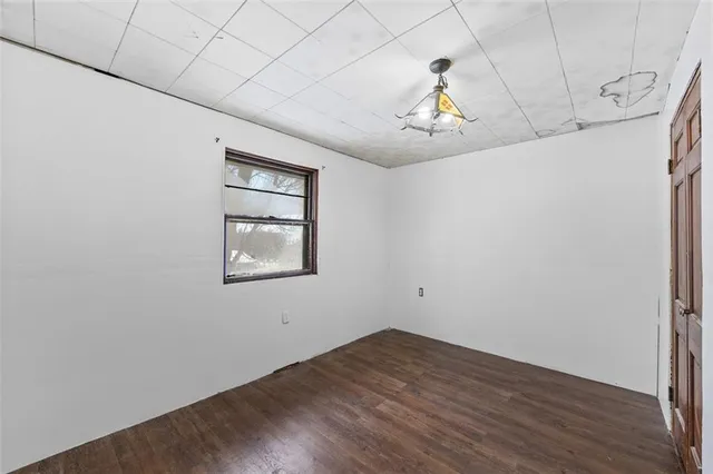 a bedroom with bed and a window