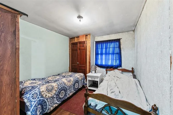 a bathroom with a double vanity sink a mirror and a toilet
