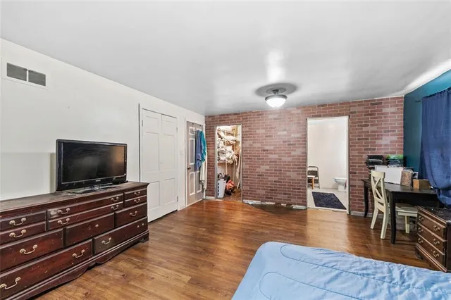 a bathroom with a tub and shower