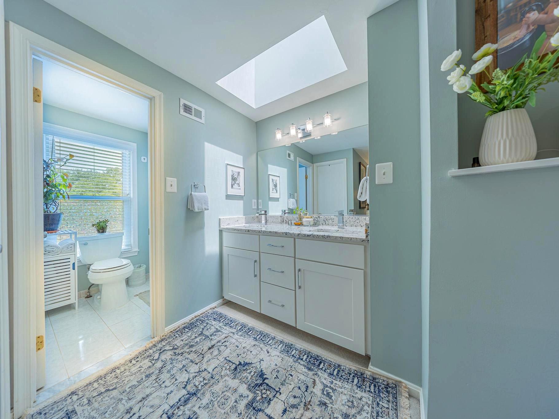 11287 Silentwood Lane Reston, VA 20191 - Photo 11 of 21 Ensuite bath has skylight & double vanity