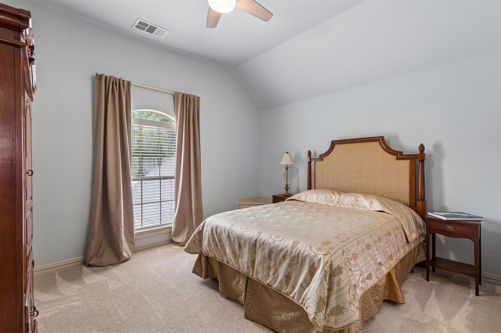 8517 Navigation Drive Rowlett, TX 75088 - Photo 34 of 39 a bedroom with a bed and a window