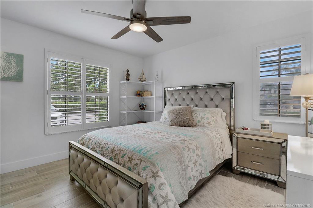 1001 Keystone Drive, Unit A Jupiter, FL 33458 - Photo 15 of 30 a bedroom with a bed and a window