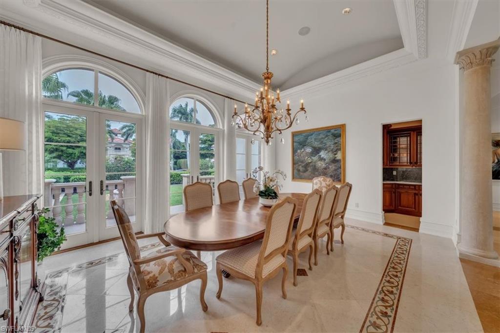 2116 Canna Way Naples, FL 34105 - Photo 14 of 50 a view of a dining room with furniture window and outside view