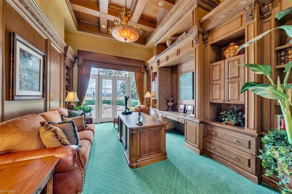 2116 Canna Way Naples, FL 34105 - Photo 18 of 50 a living room with furniture and a large window