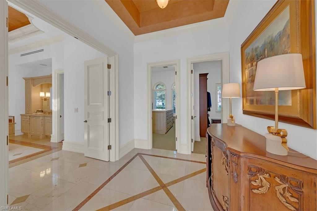 2116 Canna Way Naples, FL 34105 - Photo 22 of 50 a bathroom with a sink and a mirror