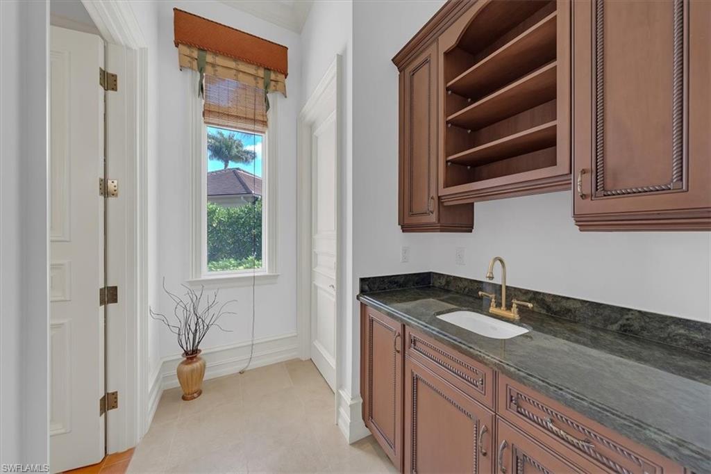 2116 Canna Way Naples, FL 34105 - Photo 24 of 50 a bathroom with a sink a vanity and a shower