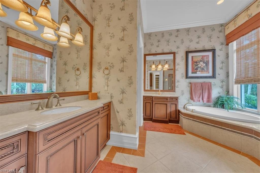 2116 Canna Way Naples, FL 34105 - Photo 26 of 50 a bathroom with a sink and a bathtub