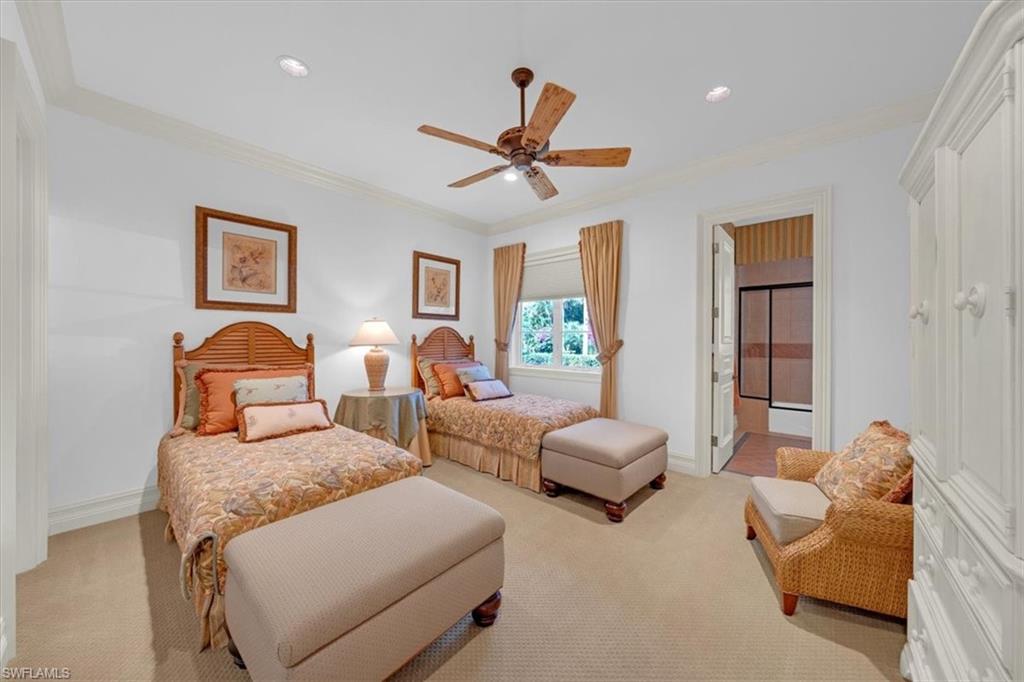 2116 Canna Way Naples, FL 34105 - Photo 29 of 50 a bedroom with furniture and a large window