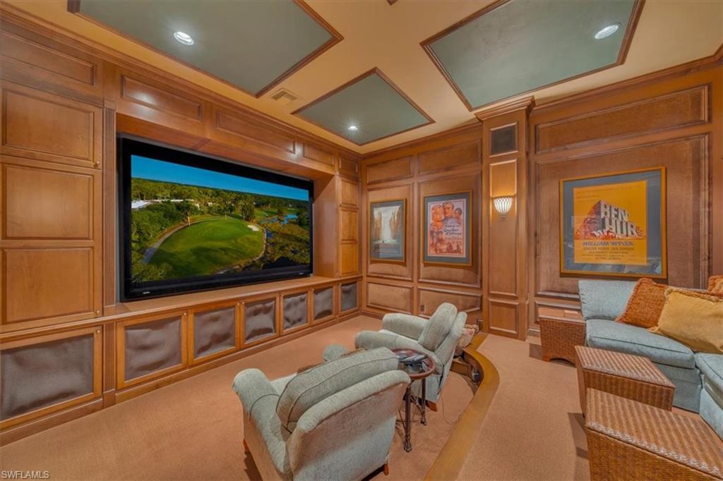 2116 Canna Way Naples, FL 34105 - Photo 39 of 50 a living room with furniture and a flat screen tv