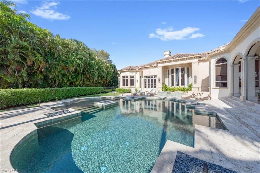 2116 Canna Way Naples, FL 34105 - Photo 47 of 50 a view of a house with a swimming pool