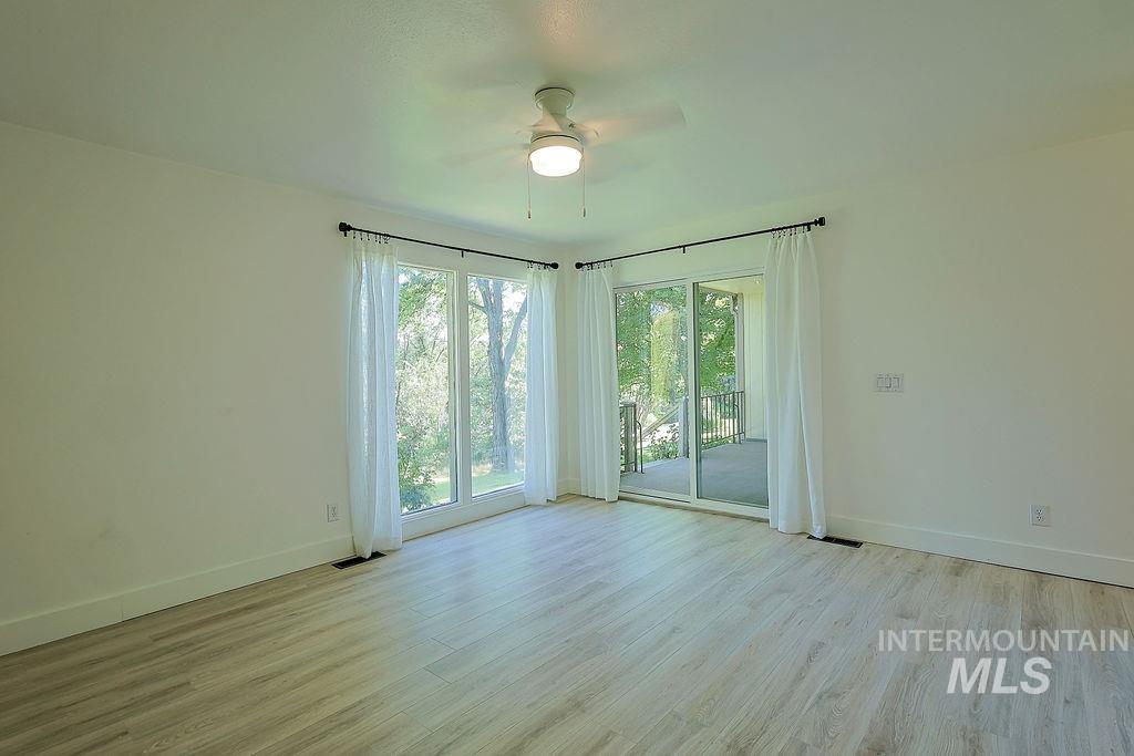 640 Morrison Street Twin Falls, ID 83301 - Photo 19 of 30 Light wood-finish flooring provides a neutral base to this room featuring white walls and a ceiling fan with integrated lighting
