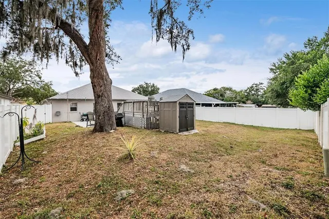 a house with a yard covered with snow in the outdoor space