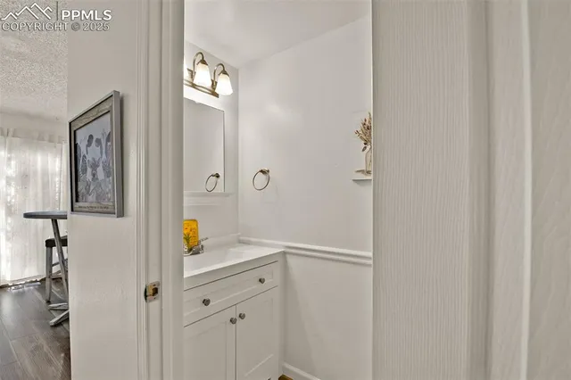 a bathroom with a shower and vanity