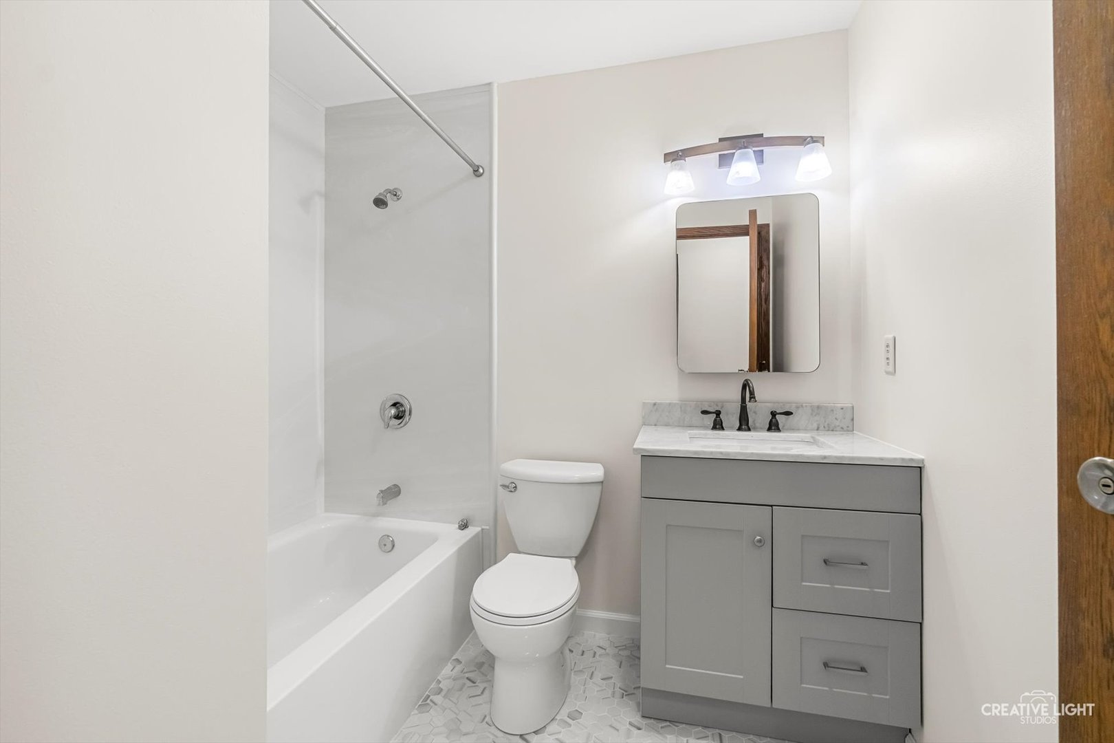 1483 Nova Road Sandwich, IL 60548 - Photo 13 of 29 a bathroom with a toilet a sink a mirror and bathtub