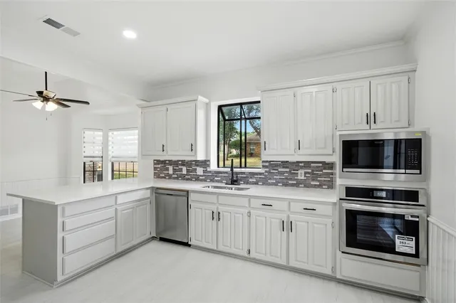 a kitchen with a sink and a window