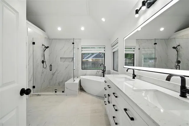 a bathroom with a bathtub and a shower