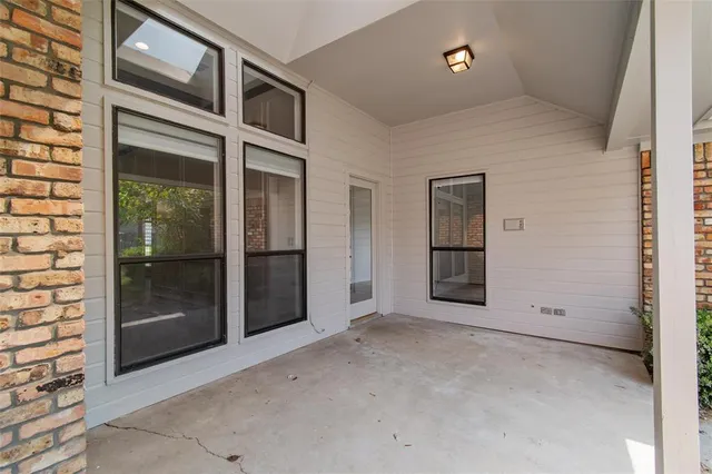 a view of a room with porch and wooden fence