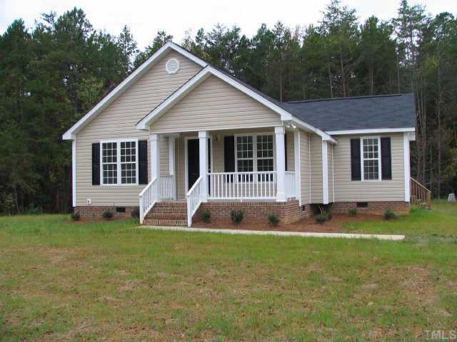 9 Range Road Oxford, NC 27565 - Photo 1 of 1 a front view of a house with a yard