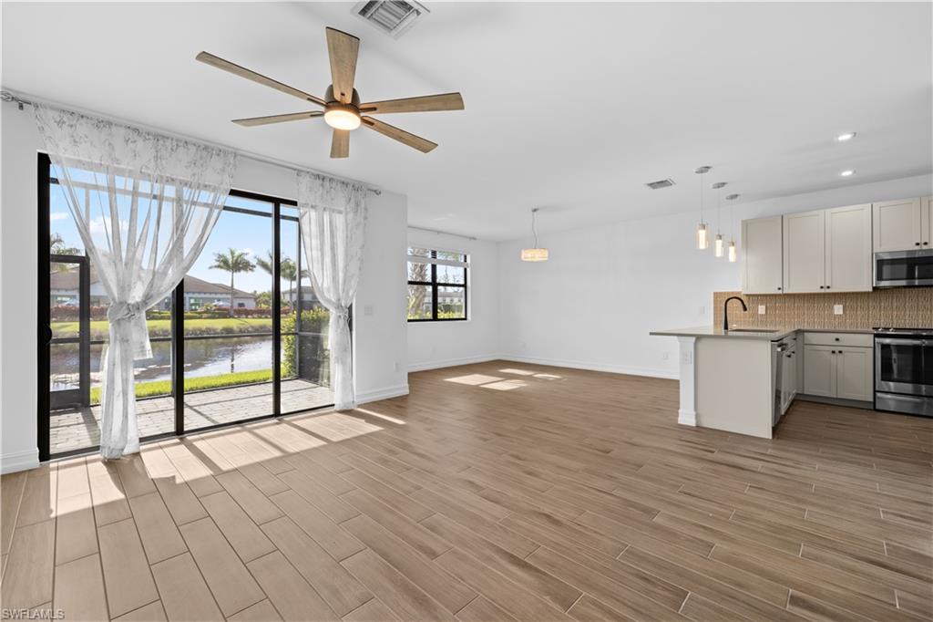 7548 Carnegie Way Naples, FL 34119 - Photo 3 of 20 Living room/dining room