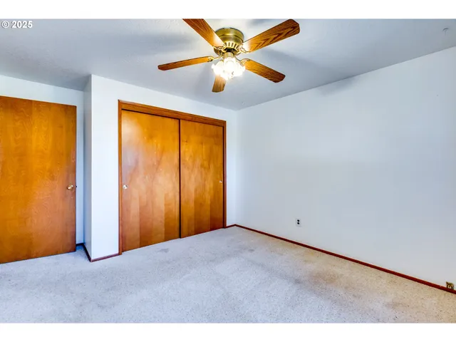 a bathroom with a toilet a sink and a mirror
