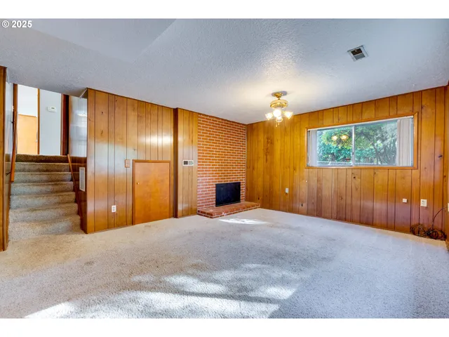 a view of empty room with a window