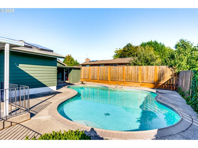 a view of a swimming pool with a porch
