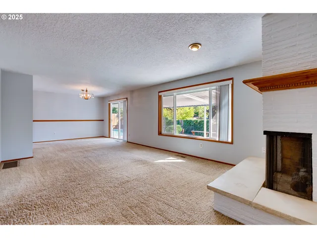 a view of a big room with closet and chandelier fan