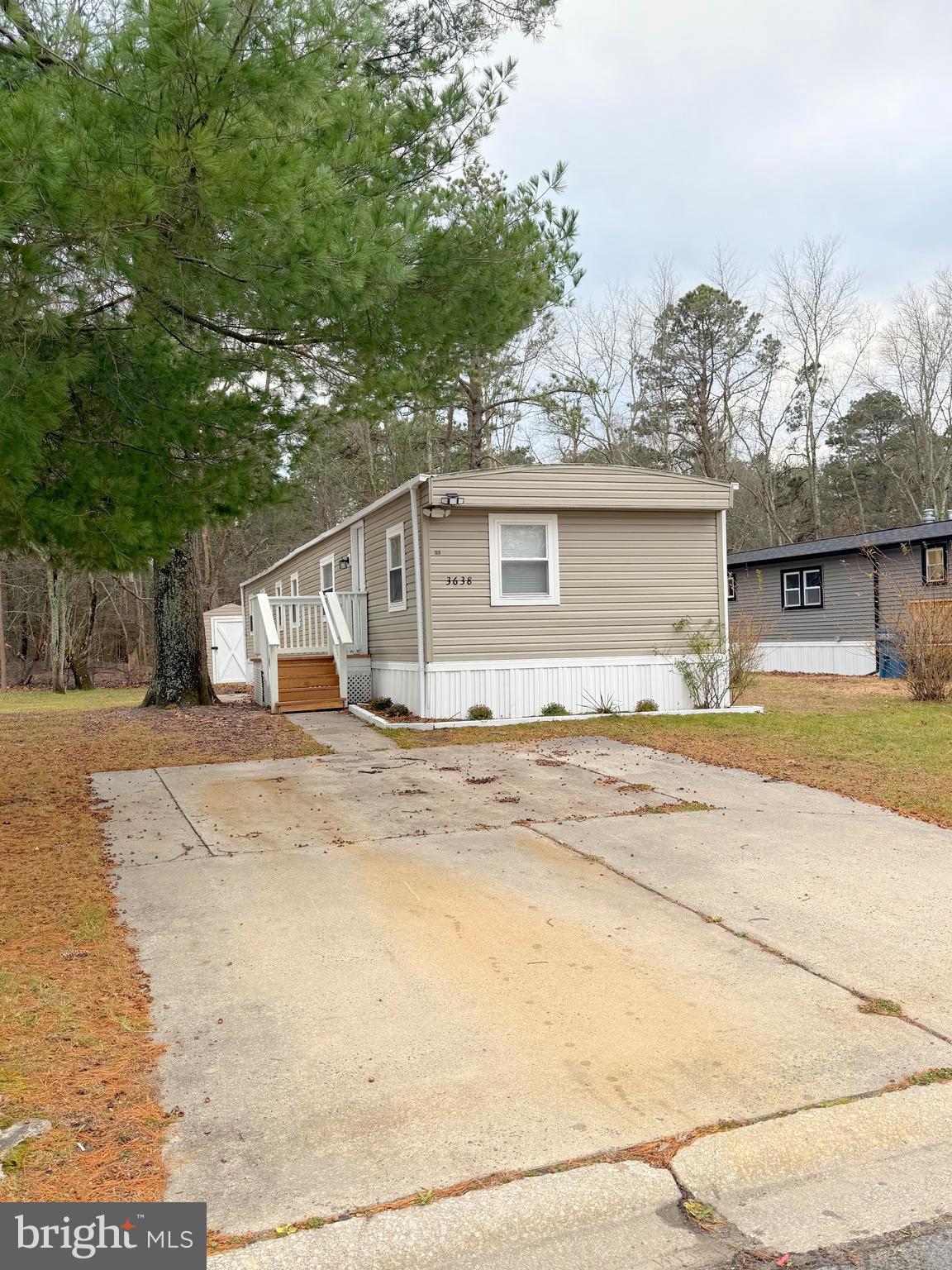 3638 Weymouth Road Browns Mills, NJ 08015 - Photo 2 of 14 a view of a white house with a outdoor space