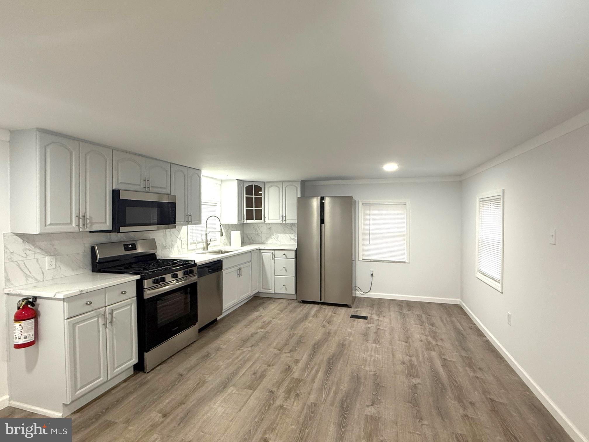 3638 Weymouth Road Browns Mills, NJ 08015 - Photo 4 of 14 a kitchen with granite countertop a refrigerator stove top oven and sink
