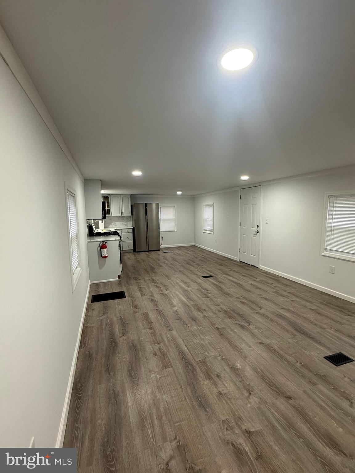 3638 Weymouth Road Browns Mills, NJ 08015 - Photo 14 of 14 wooden floor in an empty room with a window