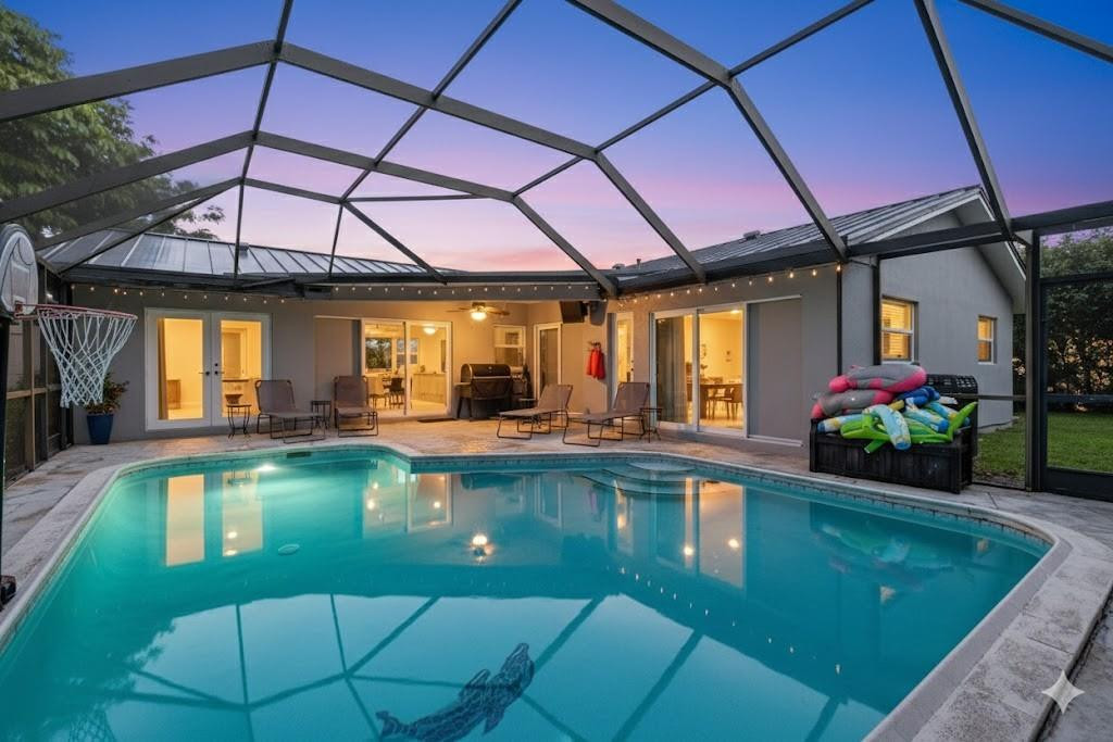 a view of a swimming pool with a patio