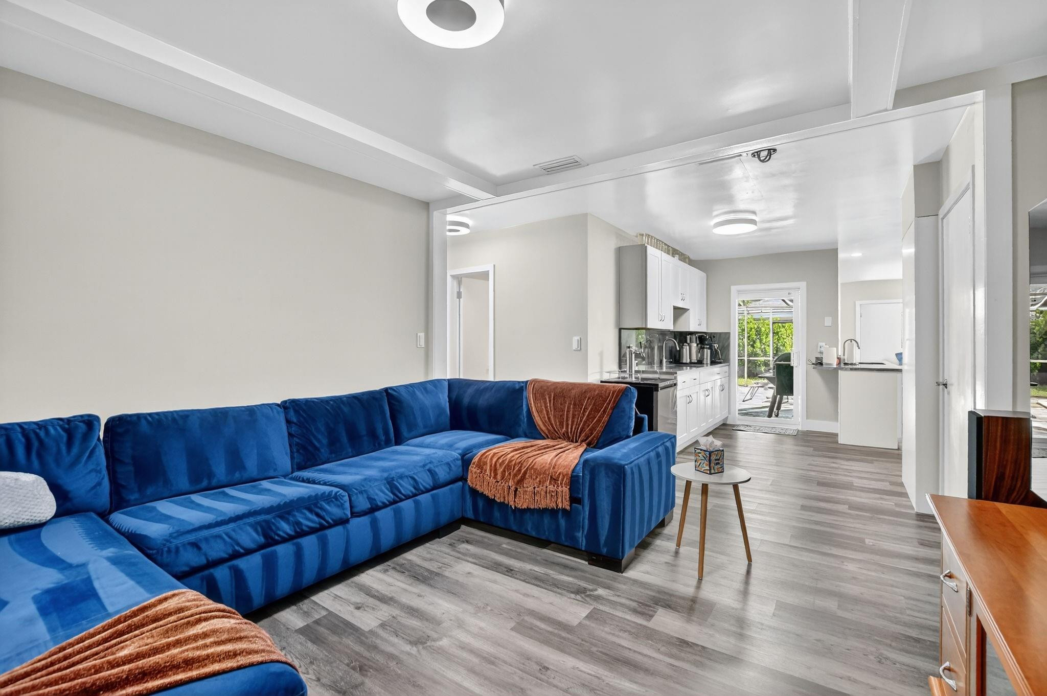 1650 Northwest 9th Street Boca Raton, FL 33486 - Photo 21 of 57 a living room with furniture and a wooden floor
