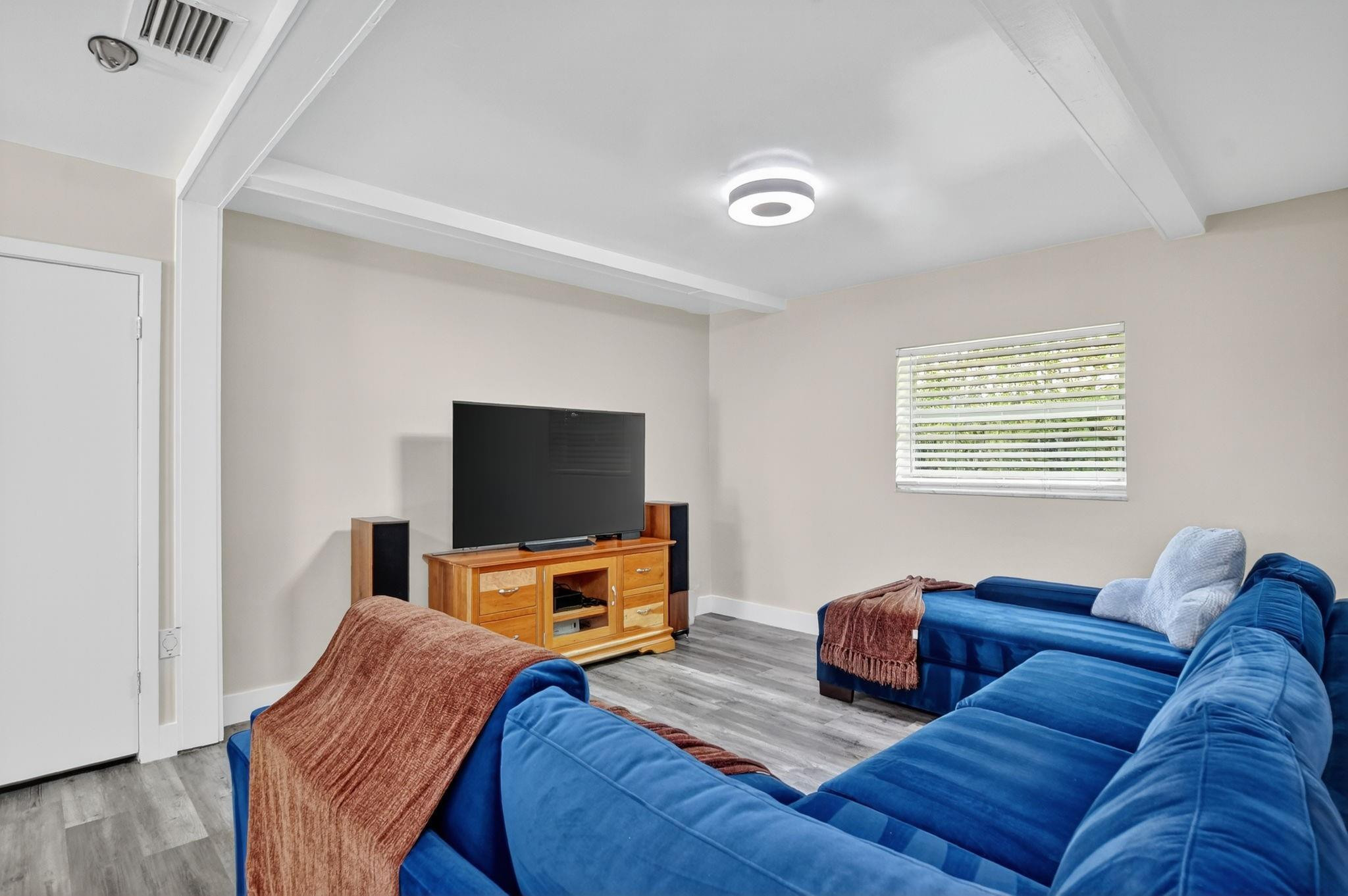 1650 Northwest 9th Street Boca Raton, FL 33486 - Photo 22 of 57 a living room with furniture and a flat screen tv