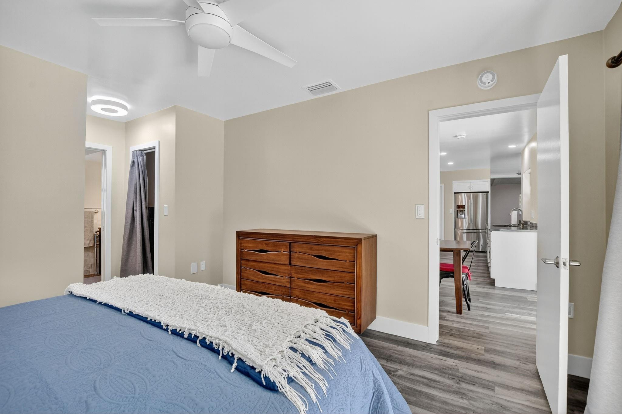 1650 Northwest 9th Street Boca Raton, FL 33486 - Photo 24 of 57 a bedroom with a bed and a dresser