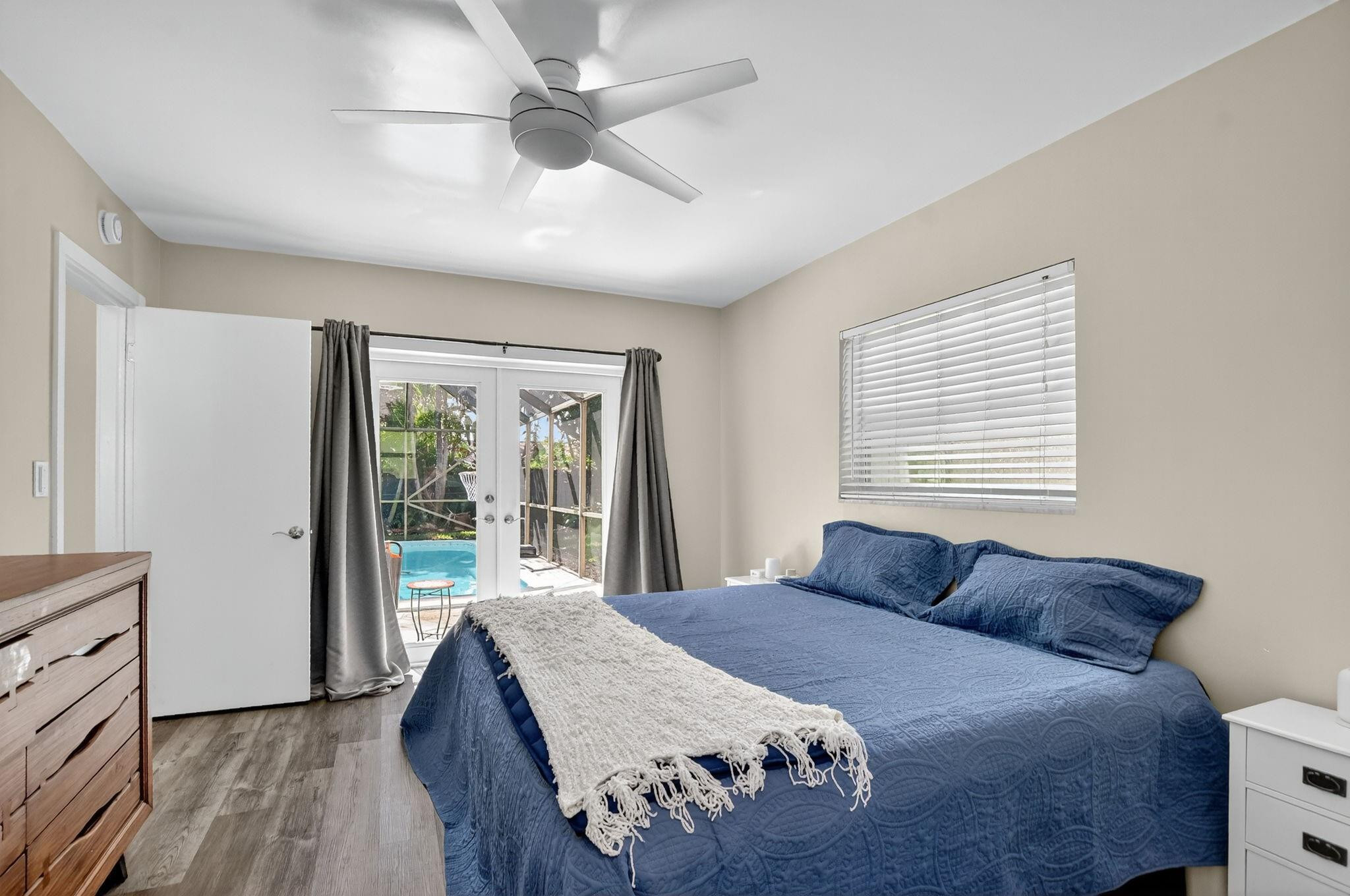 1650 Northwest 9th Street Boca Raton, FL 33486 - Photo 25 of 57 a bedroom with a large bed and a large window
