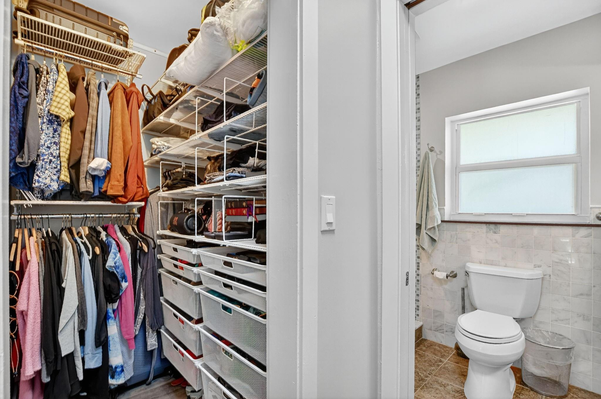 1650 Northwest 9th Street Boca Raton, FL 33486 - Photo 26 of 57 a view of walk in closet with clothes and shoes